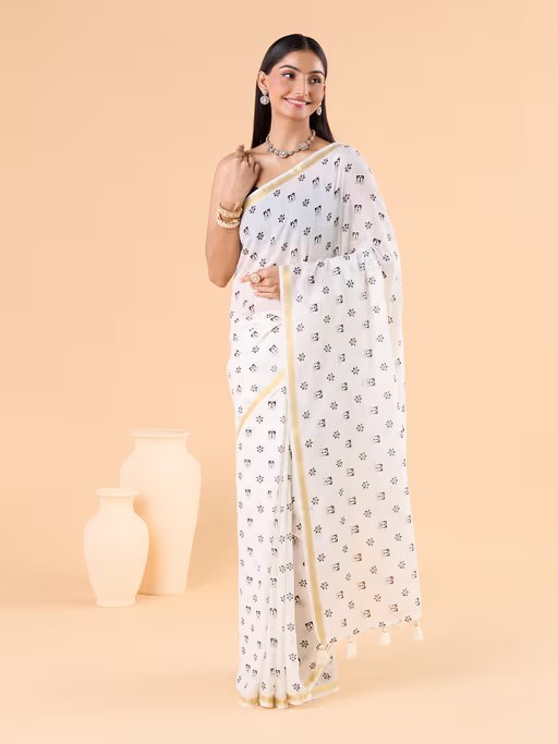 VISCOUS SAREE WITH BLACK DOTS DESIGNS AND GOLDEN BORDER FRAME