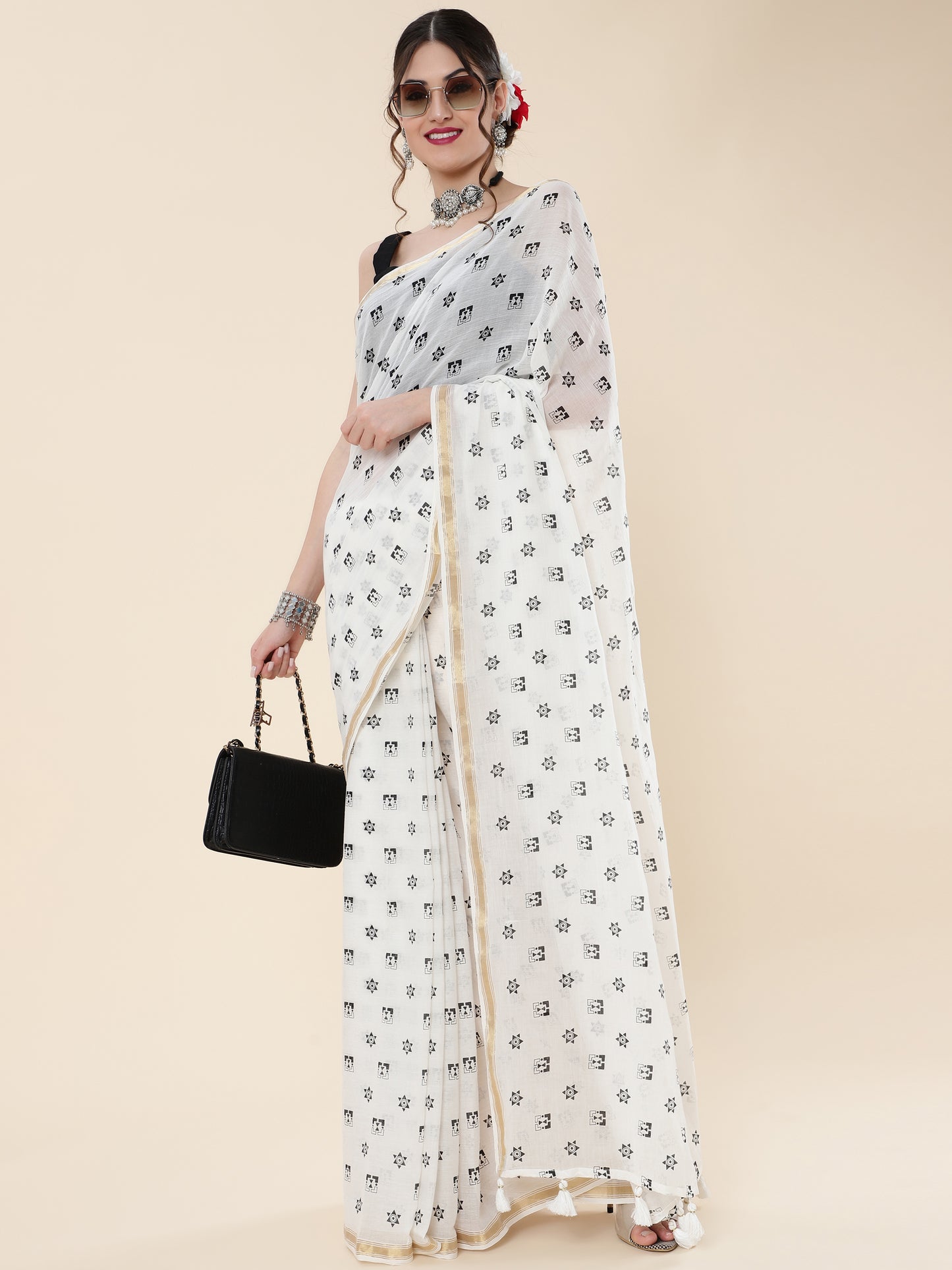 VISCOUS SAREE WITH BLACK DOTS DESIGNS AND GOLDEN BORDER FRAME