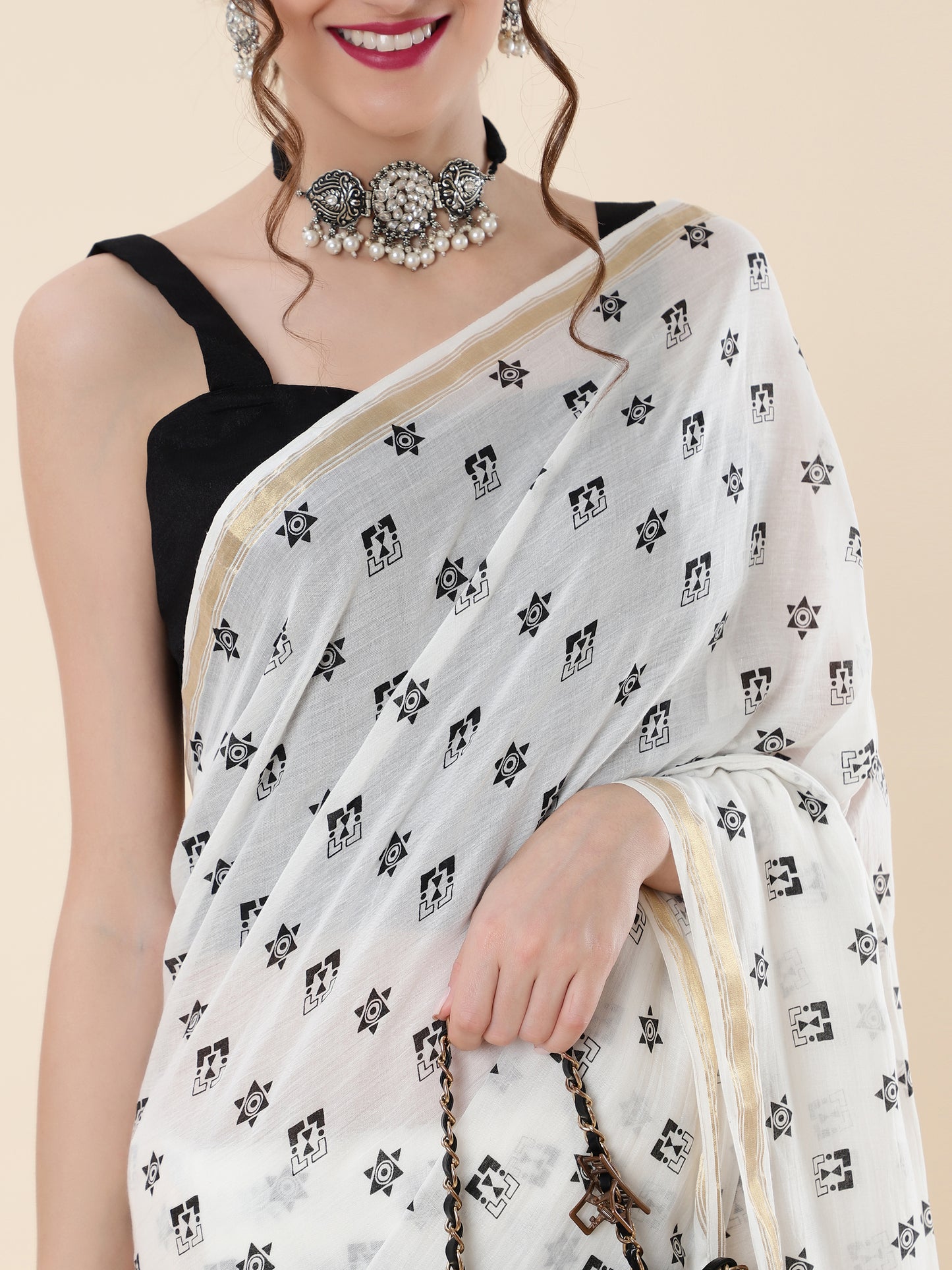VISCOUS SAREE WITH BLACK DOTS DESIGNS AND GOLDEN BORDER FRAME