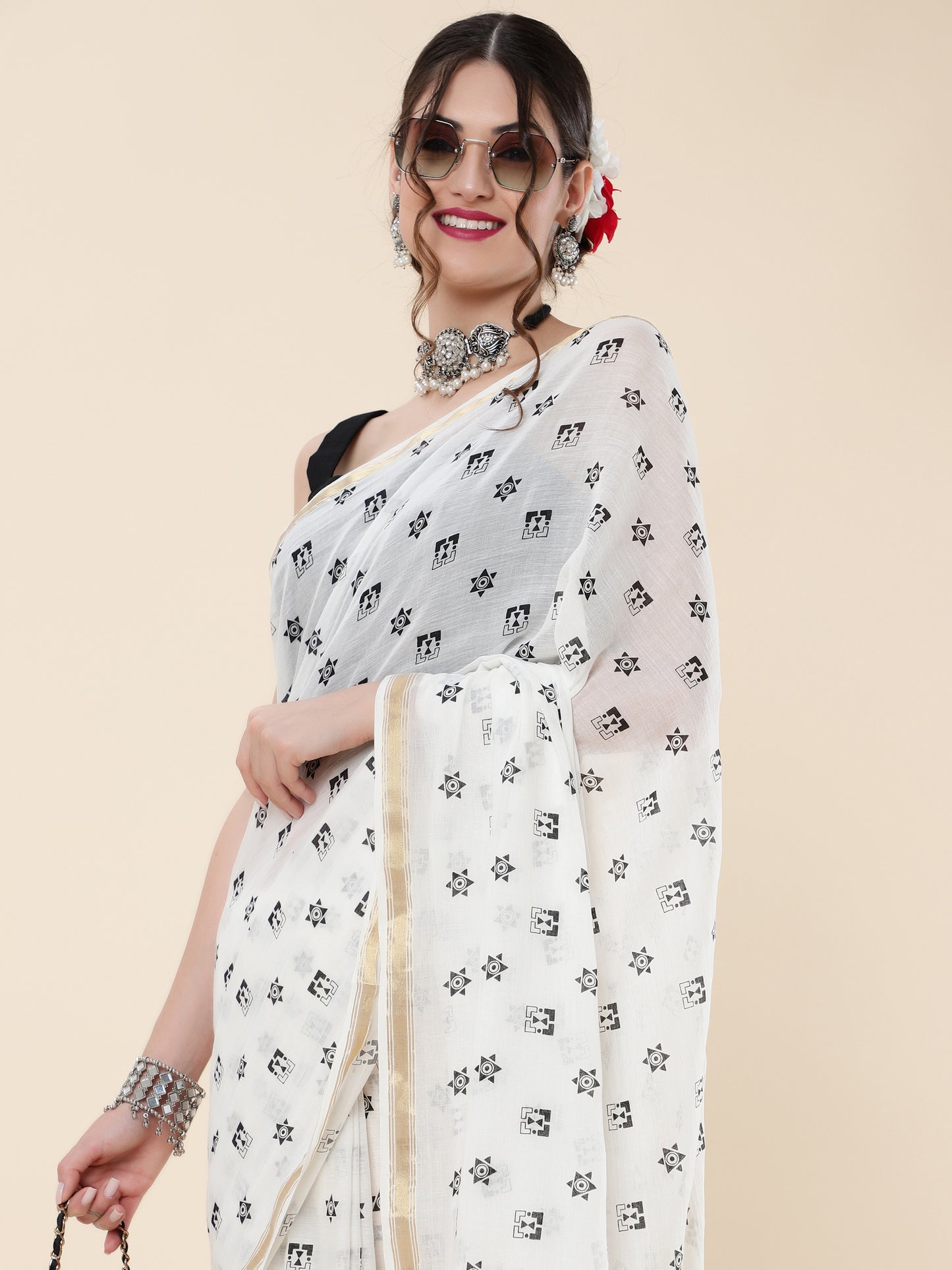VISCOUS SAREE WITH BLACK DOTS DESIGNS AND GOLDEN BORDER FRAME