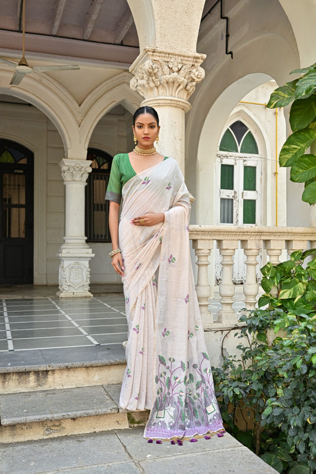 Off-White Muga Silk Saree with Violet, Pink, Blue & Purple Floral Variants.