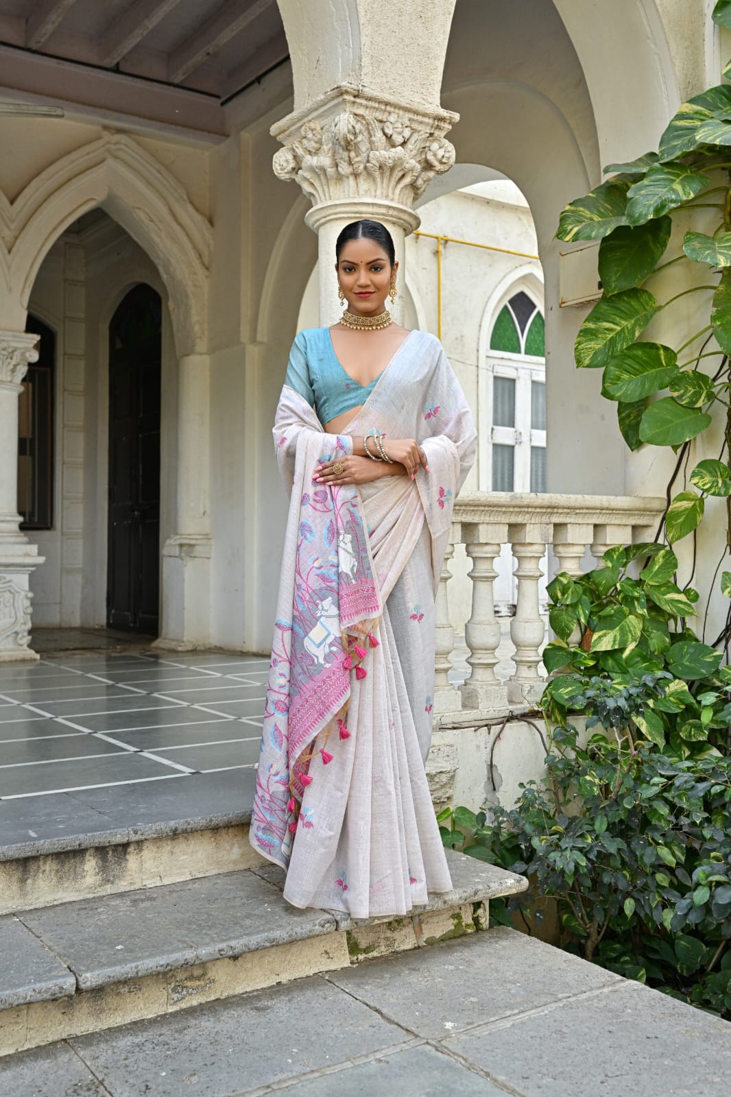 Off-White Muga Silk Saree with Violet, Pink, Blue & Purple Floral Variants.