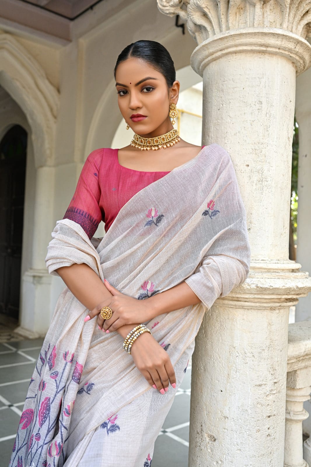 Off-White Muga Silk Saree with Violet, Pink, Blue & Purple Floral Variants.