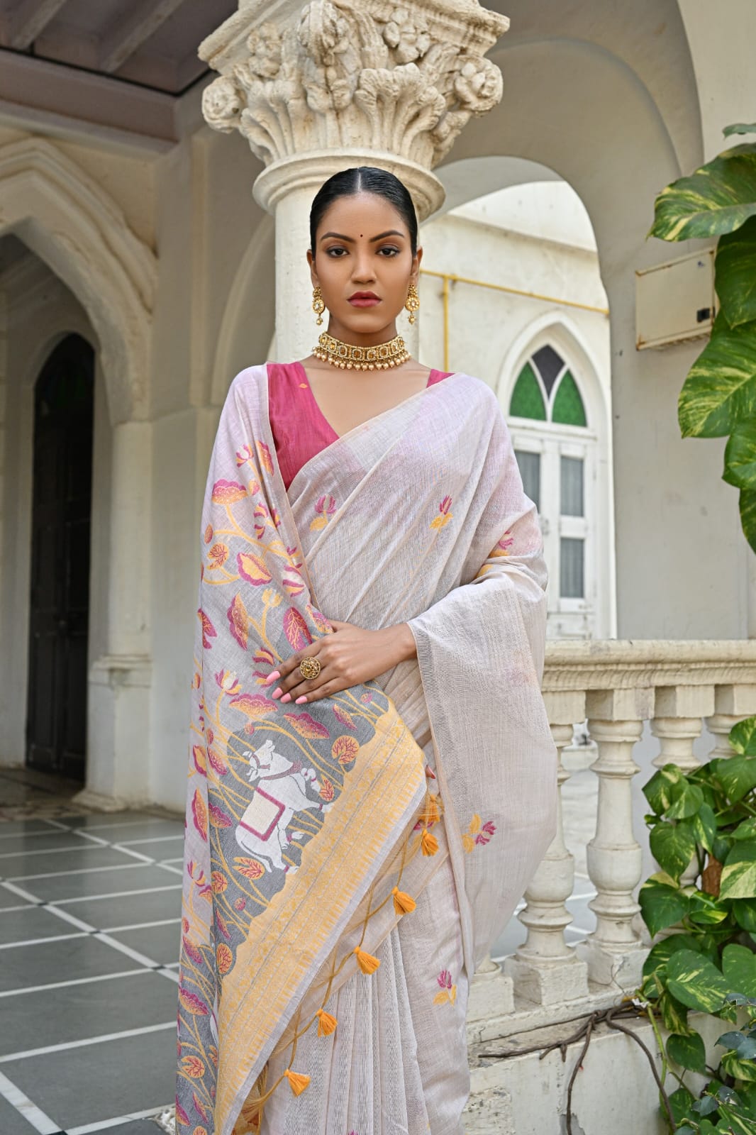 Off-White Muga Silk Saree with Violet, Pink, Blue & Purple Floral Variants.