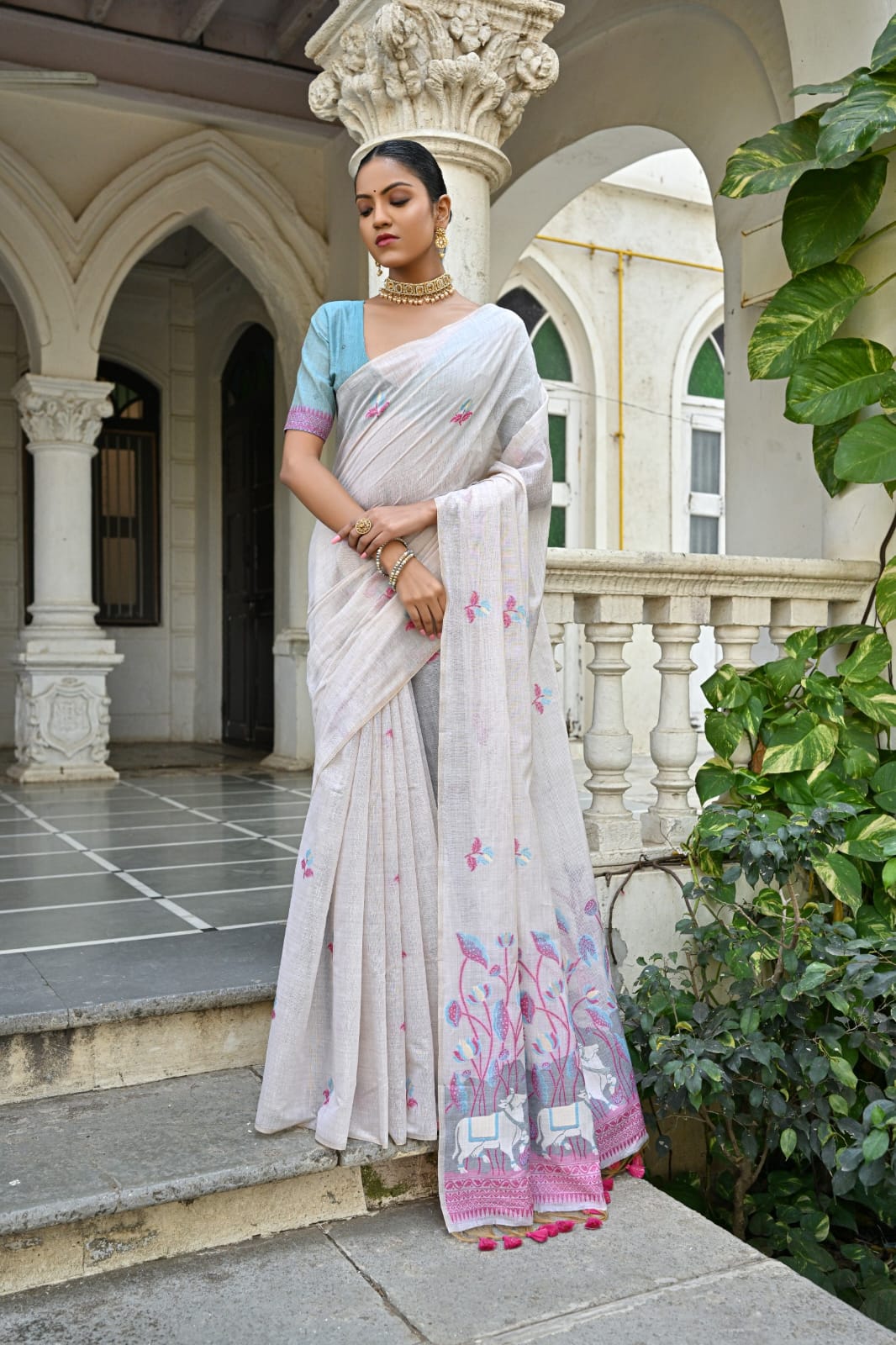 Off-White Muga Silk Saree with Violet, Pink, Blue & Purple Floral Variants.