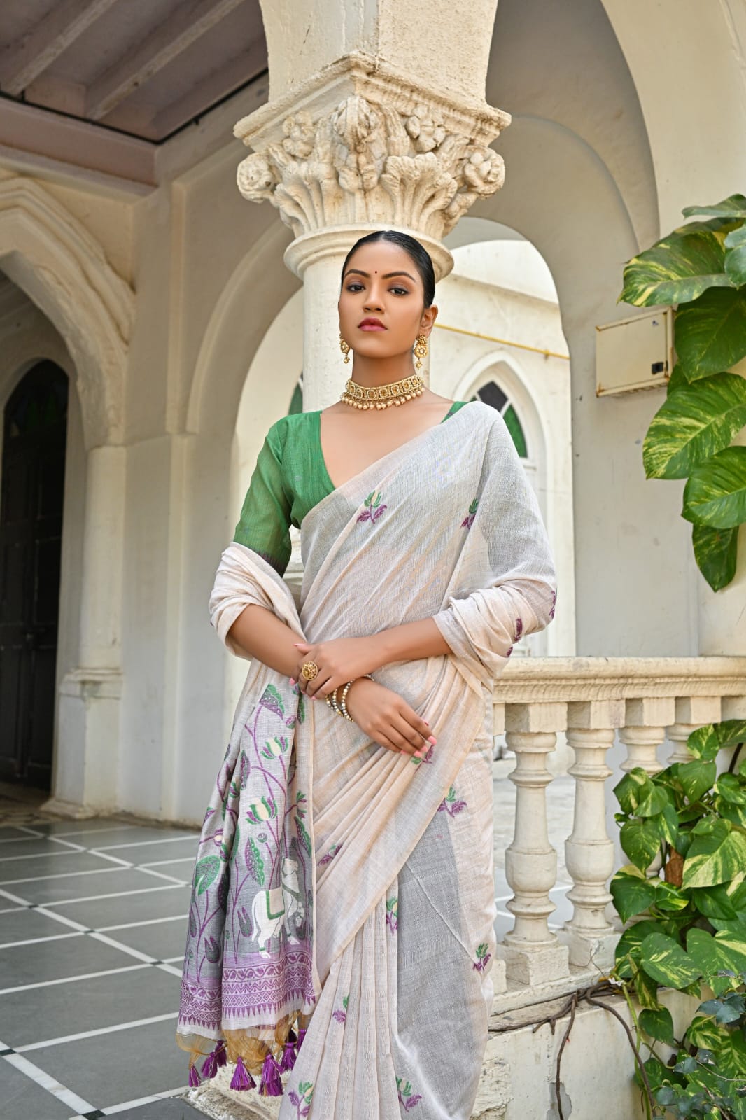 Off-White Muga Silk Saree with Violet, Pink, Blue & Purple Floral Variants.