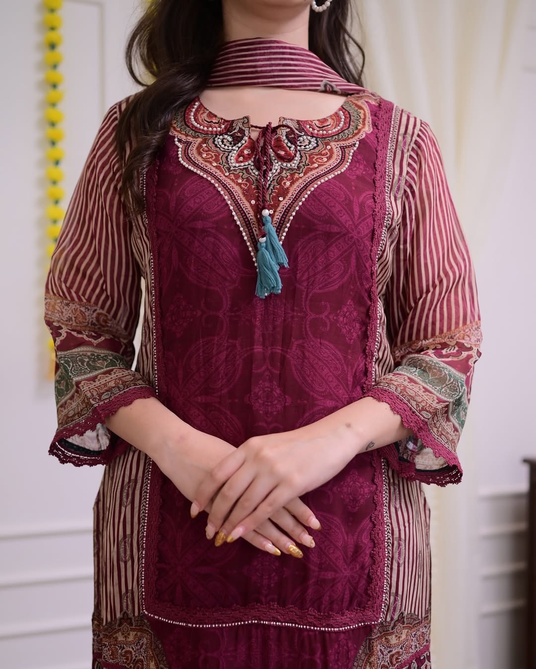 Maroon Muslin Pakistani Suit Set with Golden Accents.