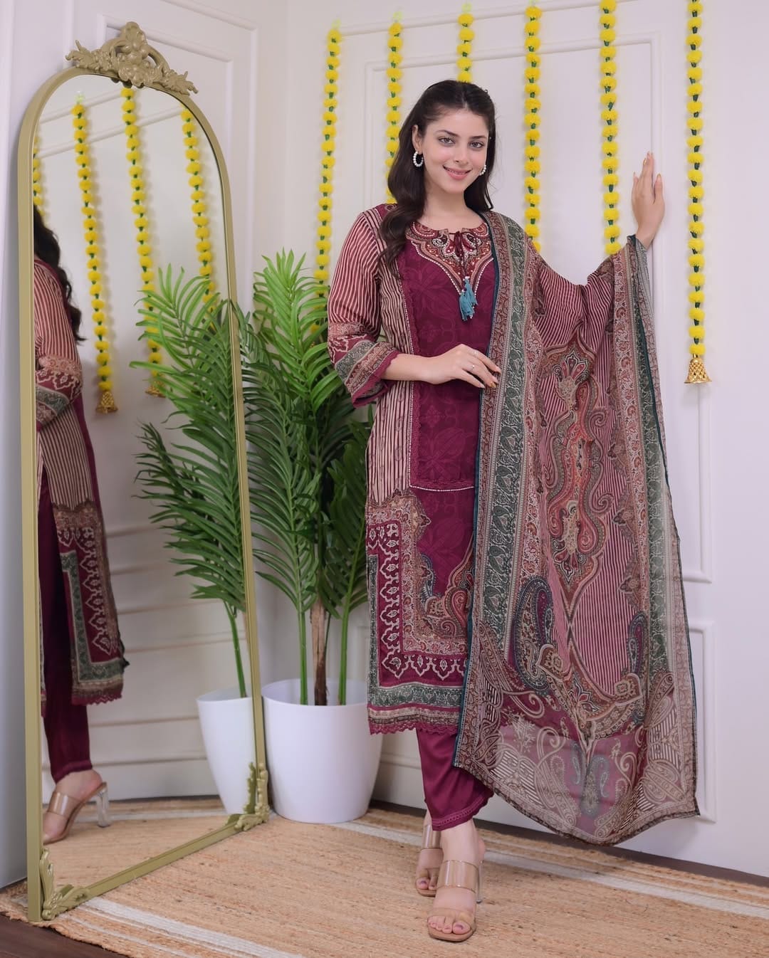 Maroon Muslin Pakistani Suit Set with Golden Accents.