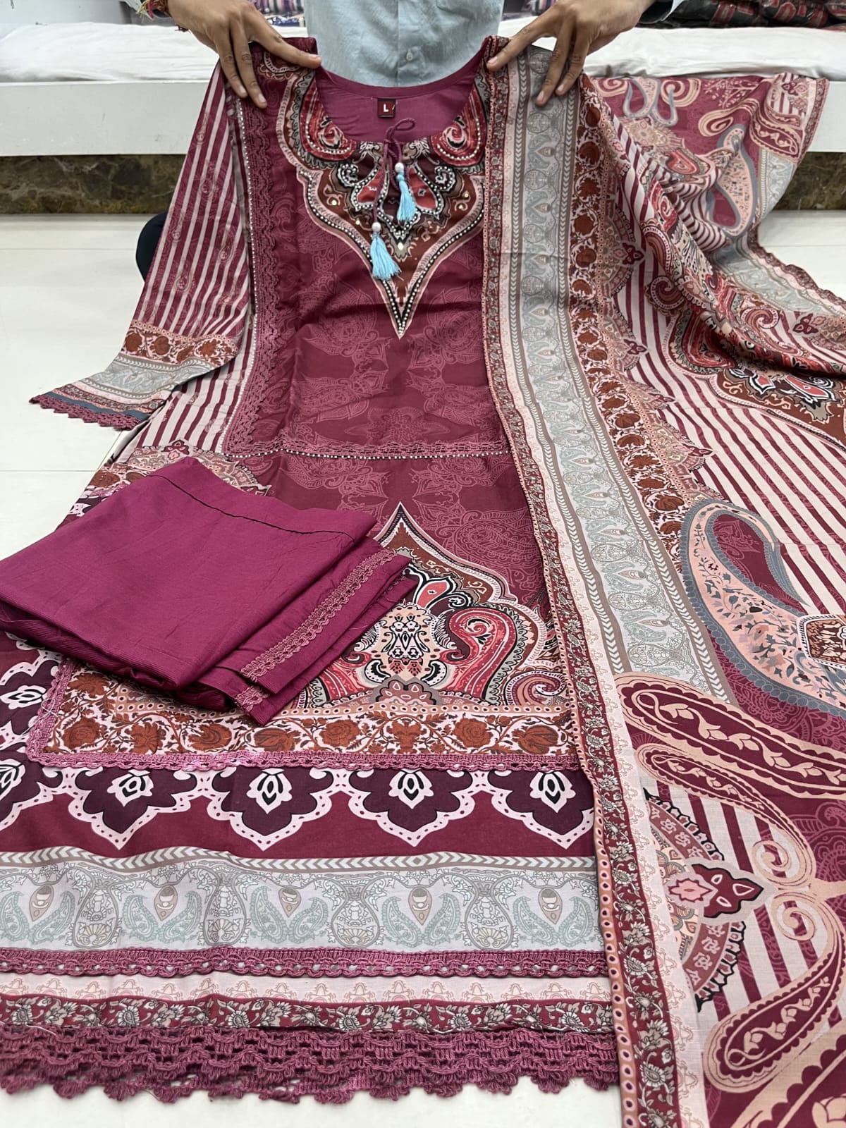 Maroon Muslin Pakistani Suit Set with Golden Accents.