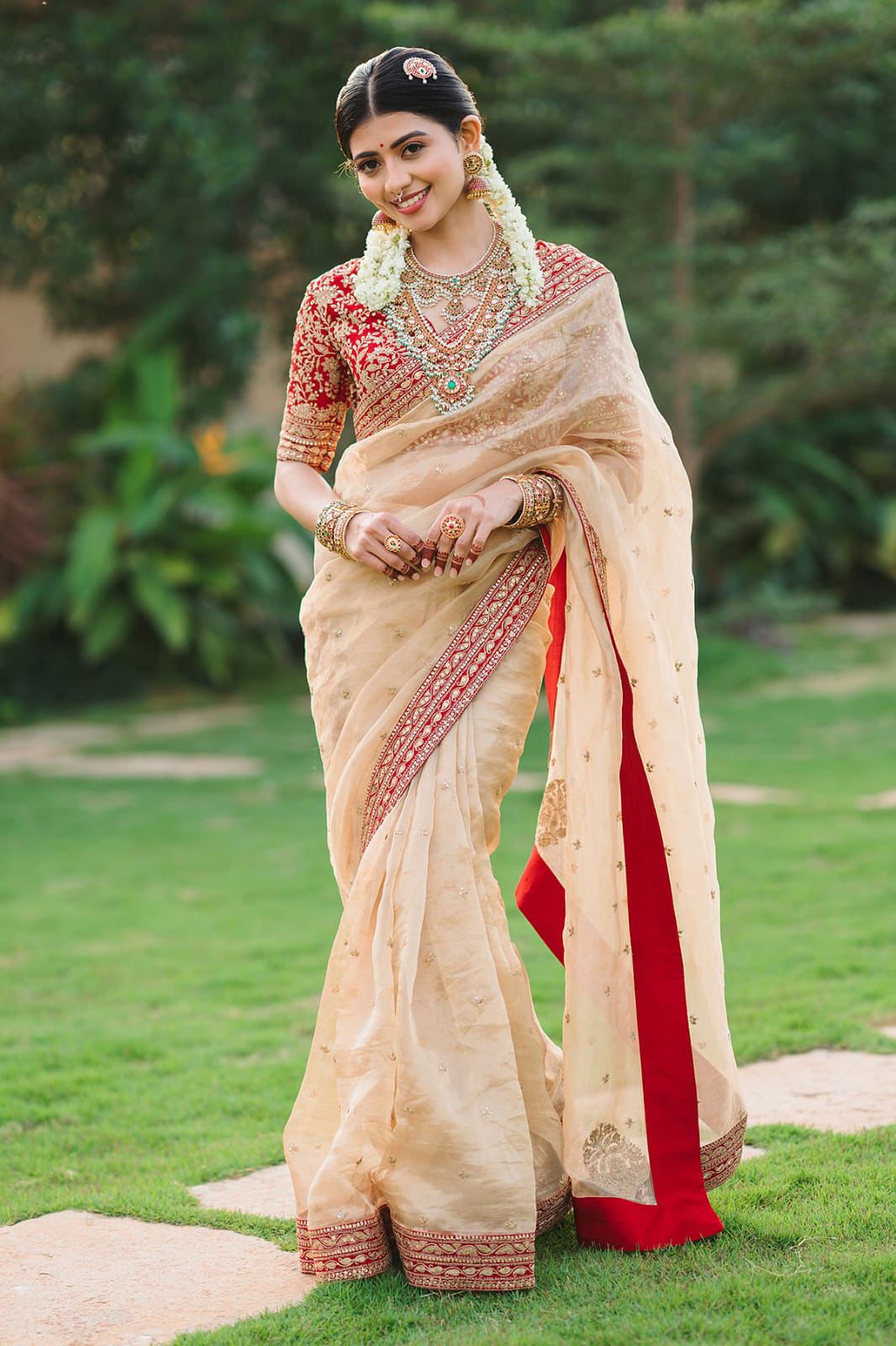 Beige Silk Saree with Red Embroidered Border & Contrasting Blouse.