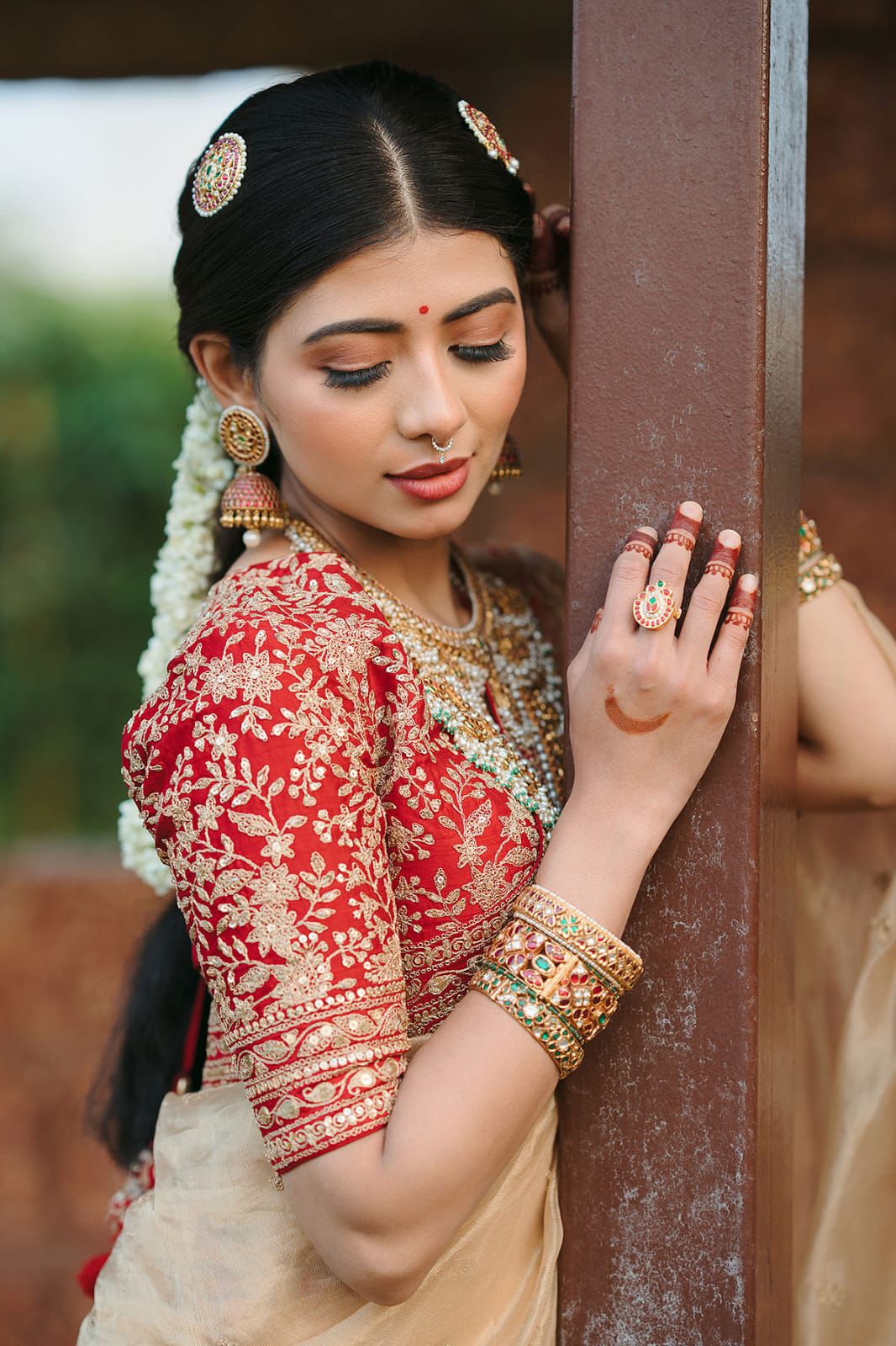 Beige Silk Saree with Red Embroidered Border & Contrasting Blouse.