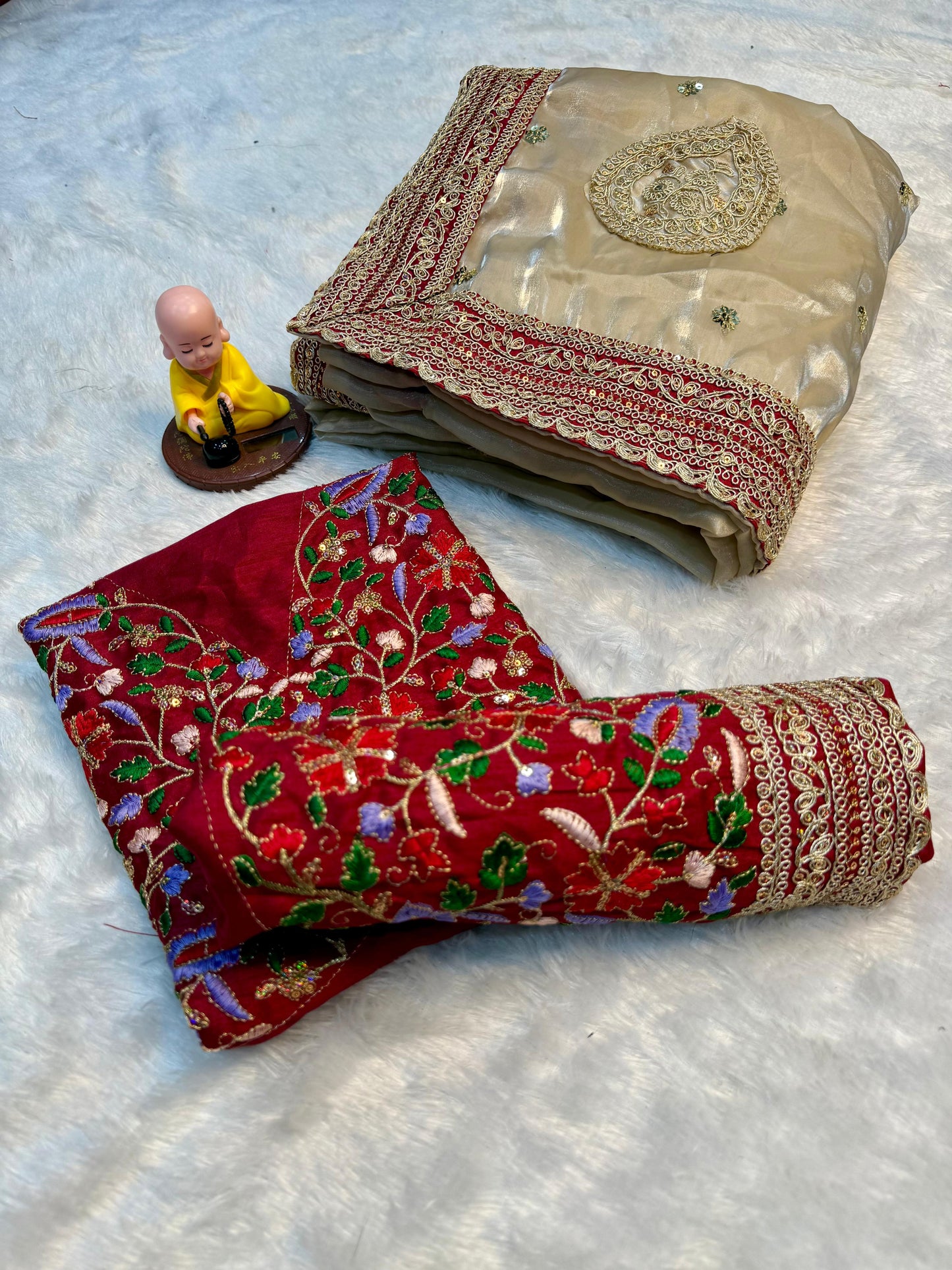 Beige Silk Saree with Red Embroidered Border & Contrasting Blouse.
