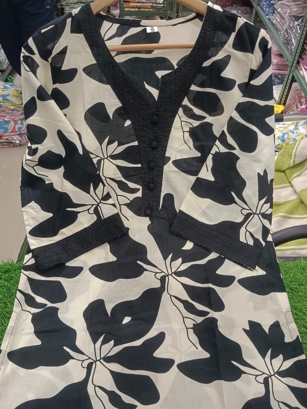 White Kurti Set with Bold Black Leaf Print & Palazzo Pants.