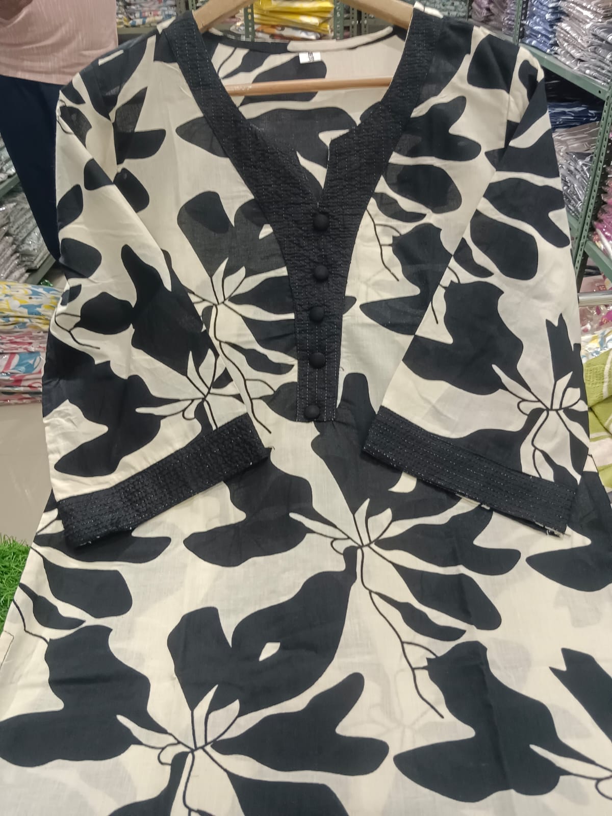 White Kurti Set with Bold Black Leaf Print & Palazzo Pants.