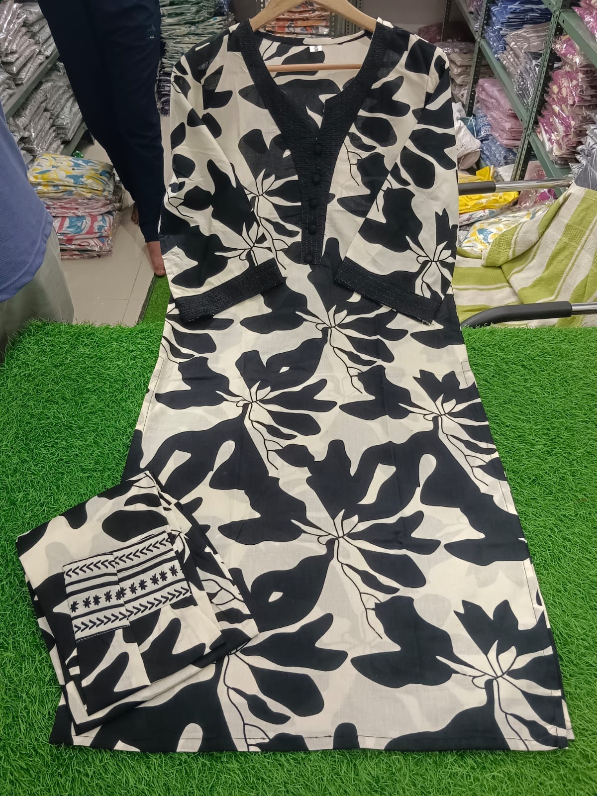 White Kurti Set with Bold Black Leaf Print & Palazzo Pants.