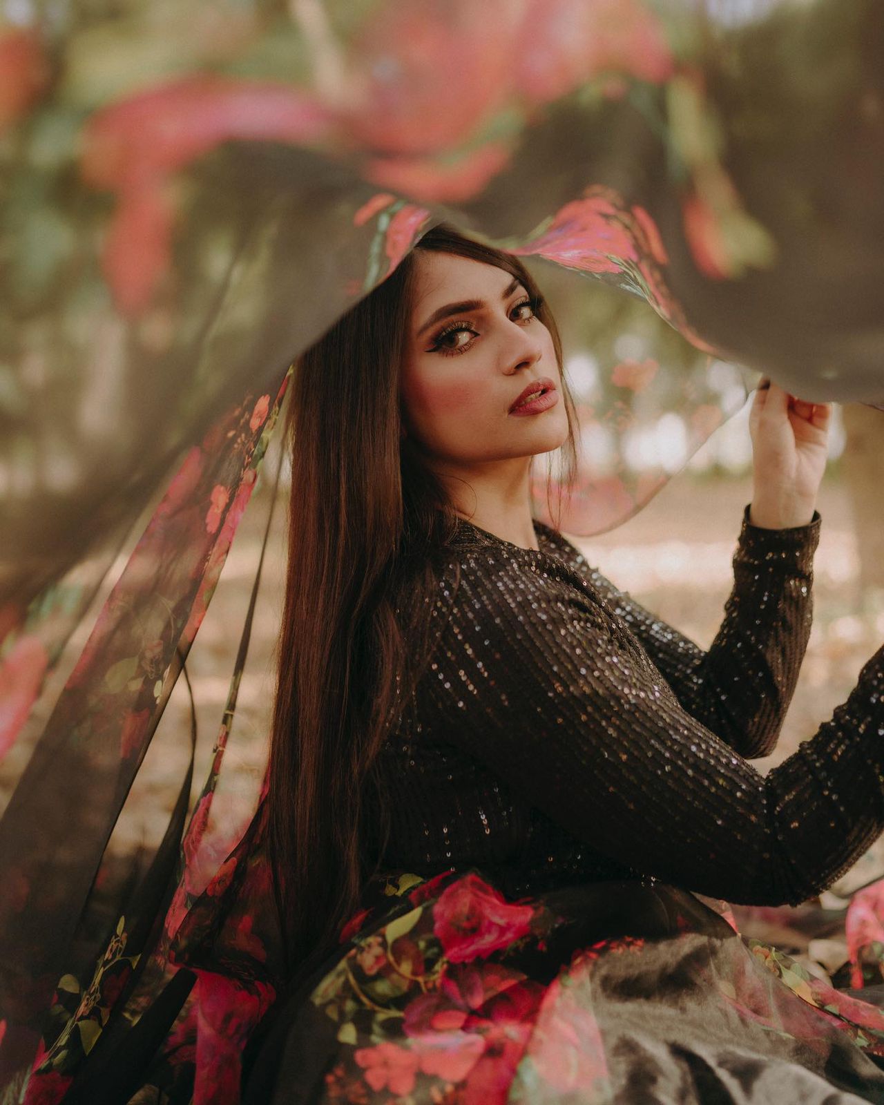 Exclusive Black Sequin Blouse with Organza Floral Lehenga Set.
