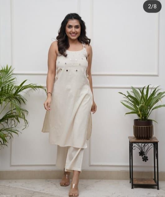 Elegant Sleeveless Cotton Flex Cord Set with Mirror Work.
