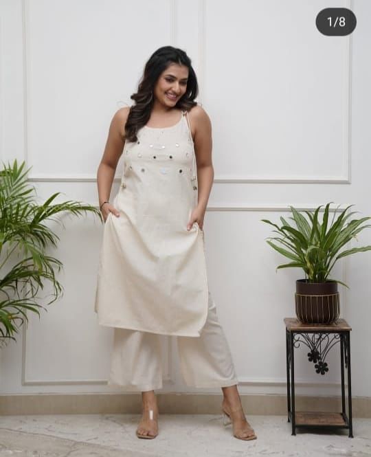Elegant Sleeveless Cotton Flex Cord Set with Mirror Work.
