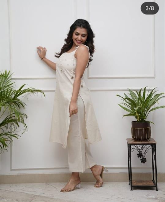 Elegant Sleeveless Cotton Flex Cord Set with Mirror Work.