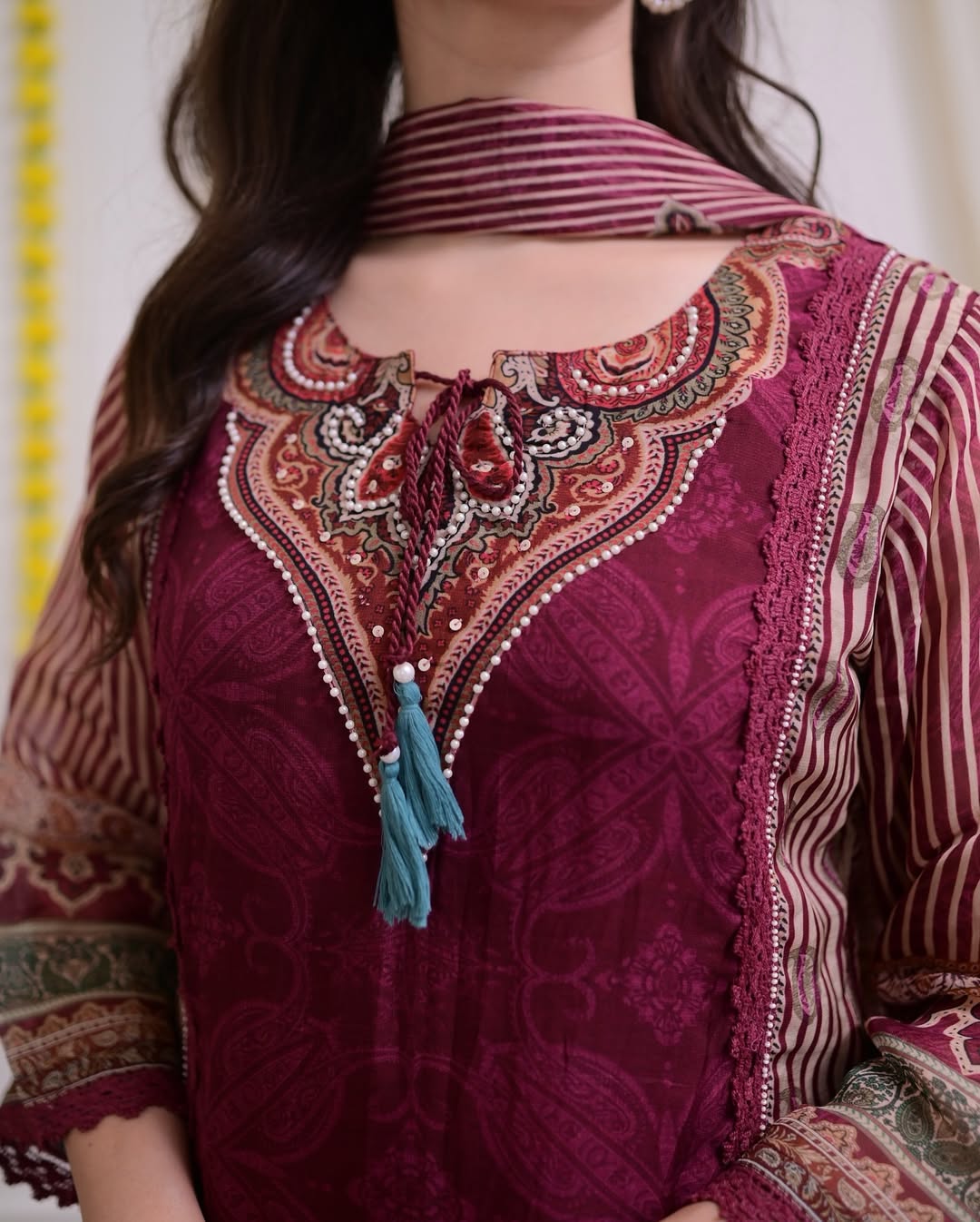 Maroon Muslin Pakistani Suit Set with Golden Accents.