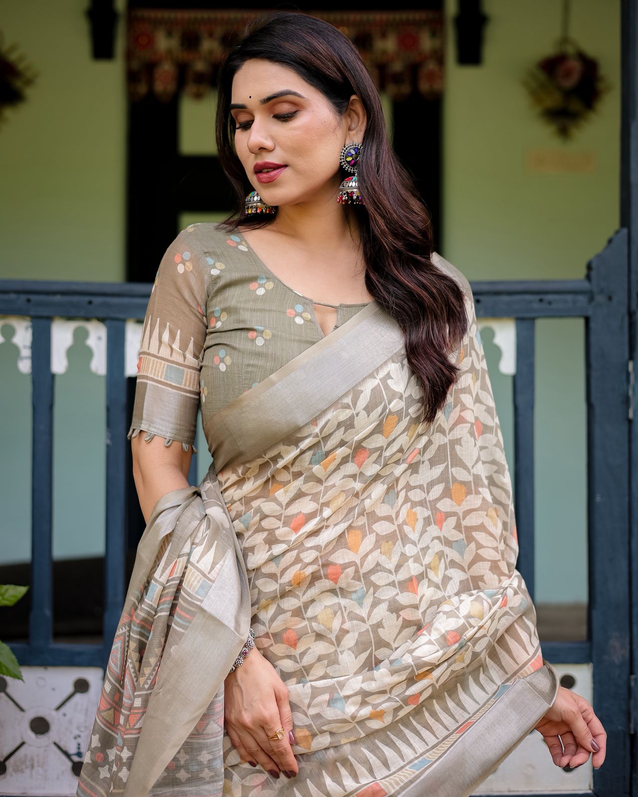 Ivory & Beige Linen Saree with Pastel Leaf Motifs & Olive Green Blouse.
