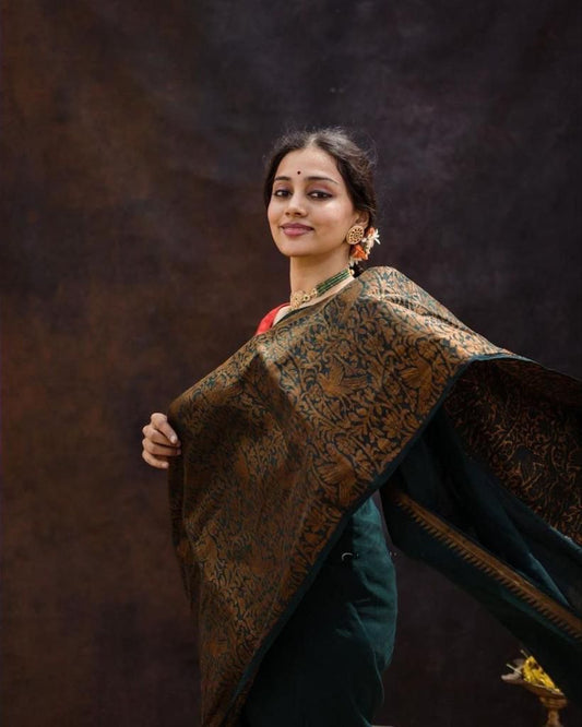 Dark Green Litchi Silk Saree with Red Jacquard Blouse.